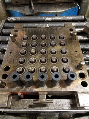 Multi-cavity mold for grommets, made based on an estimated annual usage for rubber parts.